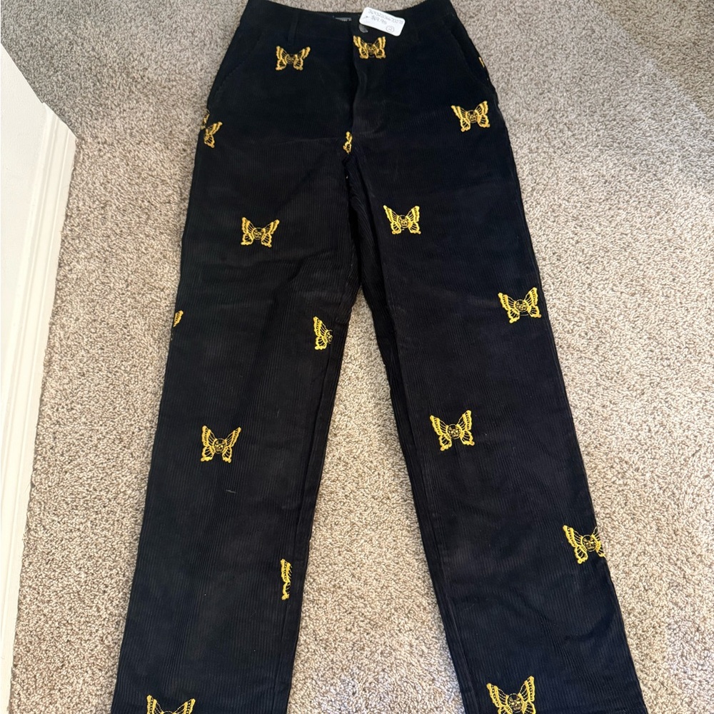 Lurking Class Black Corduroy Pants with Yellow Butterfly Design